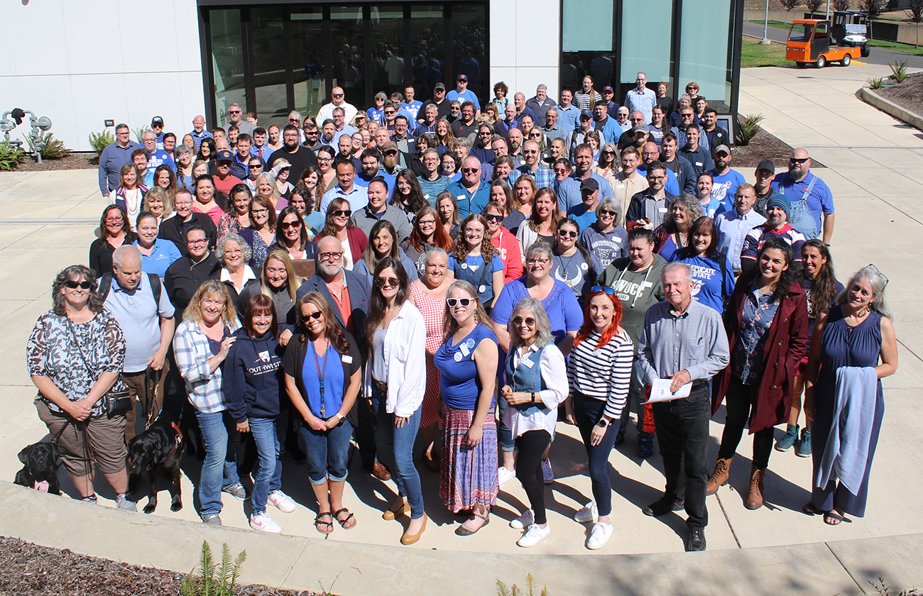 image of a large group of people standing in a patio outside