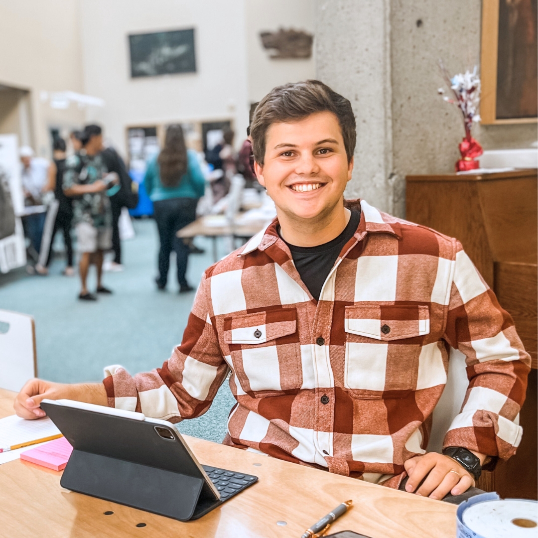 Profile photo of student Brayden Edwards sitting in front of a tablet 